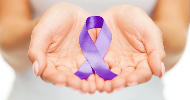 hands holding purple awareness ribbon